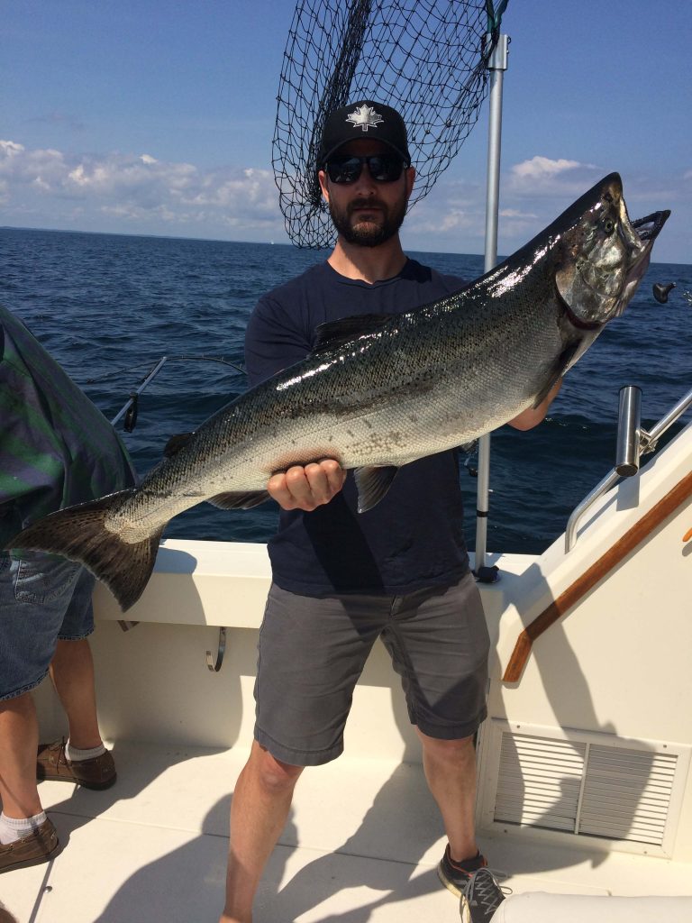 Man holding up Lake Michigan King Salmon