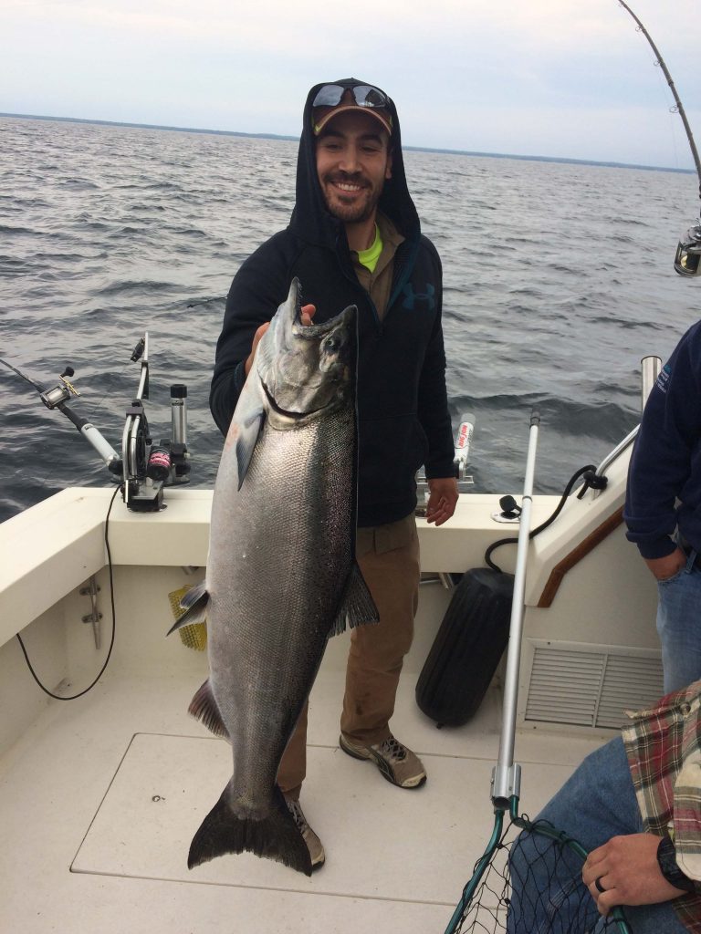 Man holding up Lake Michigan King Salmon